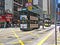 Double-storey-tram runs through a street in Hong Kong