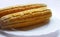 Double sweet corn .on the plate on white backgroun