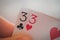 Double three, Playing cards in hand on the table, poker nands