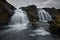 Double waterfall in river with silky water. dry autumn grass- Fairy Pools - Skye Island - Scotland - Uk