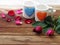 Double white mugs like that represents the couple are painted heart-shaped blue and orange. The front has red and pink roses