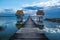 Double wooden old dock during sunset at lake Itza, El Remate, Peten, Guatemala