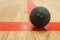 Double yellow dot squash ball on t-line