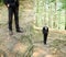 Doubled picture of stylish groom posing in the wood