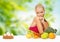 Doubting woman with fruits looking at cake