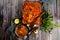 Dough baked herring fish with tomato sauce and onion in a glass bowl. Fish, baked with vegetables in tomato sauce.