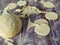 Dough circles on a wooden table.  Potato dumplings