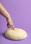 Dough isolated on a purple color. Testing leavened dough. Bread baking