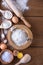Dough preparation - flour, broken egg and wooden
