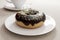 Doughnut on a plate, close-up view with shallow depth of field, 3d render. Photorealistic illustration of a tasty donut