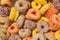 Doughnut shaped and circular cereals, very colorful