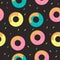Doughnuts with colored cream on a dark background. Vector illustration.