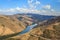 The Douro valley with its river and its vineyards cultivated in terraces on the mountainsides. Superb cloudy sky reflected in the