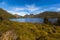 Dove Lake across buttongrass moorland with Cradle Mountain in ba