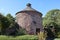 The dovecote at Dunster in Somerset. Ancient monument with weather vane