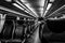 Dover, NJ USA - November 1, 2017: NJ Transit train at night with empty seats, black and white