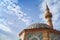 Doves fly over Ancient Camii mosque, Izmir