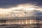 Doves sitting on a pier at dawn on cloudy morning