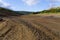 Down the muddy bottom of an empty Ladybower reservoir