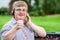 Down syndrome boy with headset doing thumbs up.