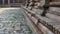 Down to earth view of the temple exterior filled with intricate sculpture, Dharasuram, Tamil Nadu, India