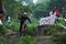 Downhill Bike Festival in Yogyakarta `Teras CAF`. A participant in the Mountain Bike Festival cycles down the hill fast and agil