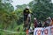 Downhill Bike Festival in Yogyakarta `Teras CAF`. A participant in the Mountain Bike Festival cycles down the hill fast and agil