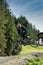 Downhill mountain biker jumping high and riding hard in Lenzerheide in the Swiss Alps