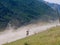 Downhill Mountainbiker on dirt road from Ushguli mountain village, Svaneti, Georgia to Mestia.