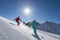 Downhill skiing in behind the sun
