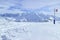 Downhill skiing in high Alps, snowy mountain peaks panorama