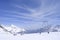 downhill skiing on prepared ski slope in Swiss Alps