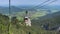 Downhill view from a red ropeway from the Chiemgau Kampenwand down to the city Aschau in the southern bavaria germany