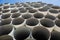 Downpipe warehouse. Steel pipes, parts for the construction of a roof drainage system in a warehouse. Stack of stainless