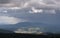 Downpour over mountain and gloomy clouds