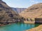 Downriver view of gorge and breakers at impressive Katse Dam hydroelectric power plant in Lesotho, Africa