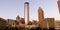 Downtown Atlanta Skyline showing several prominent buildings, apartments, offices and hotels under a blue sky