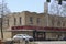 Downtown Augusta Georgia traffic and funky sign on building and cars