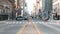 Downtown cityscape time-lapse of car traffic transportation, people walk cross road in Philadelphia, USA. Public transport concept