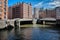 Downtown Hamburg on a cloudy day. Boats passing on the waterways.