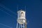 Downtown Harlem Old water tower with art work of Oliver Hardy power lines