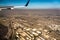 Downtown los angeles skyline and suburbs from airplane and smoke from wild fires