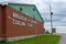 Downtown rural sreet of small town Canadian city of Brighton near presquile lake provincial park curling club sign and arena