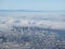 Downtown San Francisco aerial view taken from an airplane as fog