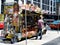 Downtown Toronto street view with hot dog street vendor and colorful cart