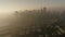 Downtown towers San Francisco and Coit Tower in morning sunrise mist silhouettes