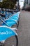 DOWNTOWN VANCOUVER, BC, CANADA - APR 26, 2020: Mobi shared bikes sit unused in English Bay due to the stay at home