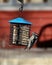 Downy woodpecker at a suet feeder