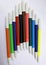 a dozen colored markers on a white background