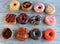 Dozen Dough Nuts in rows on wooden background